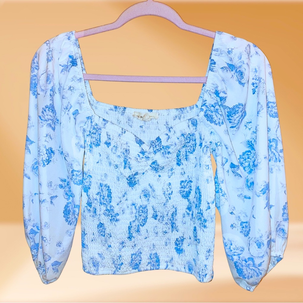 Blue and white floral smocked blouse